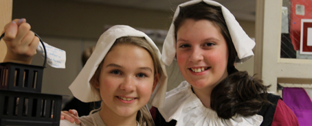 Dayspring students volunteer at Thanksgiving Exposed to show the Pilgrims' story.